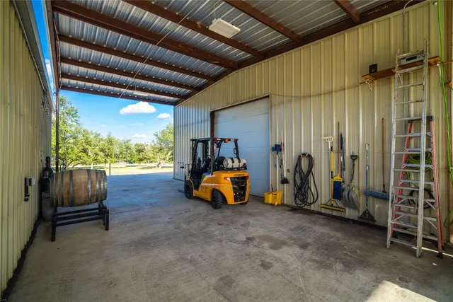 an empty room with wooden floor and furniture