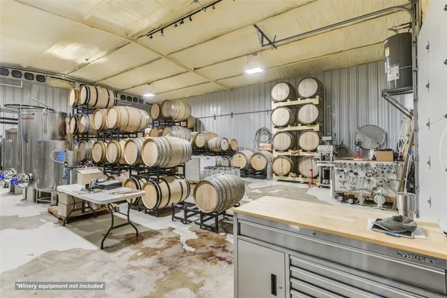 a room with lots of chairs and mirrors