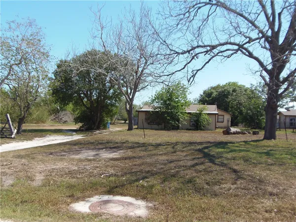 a house with yard in front of it