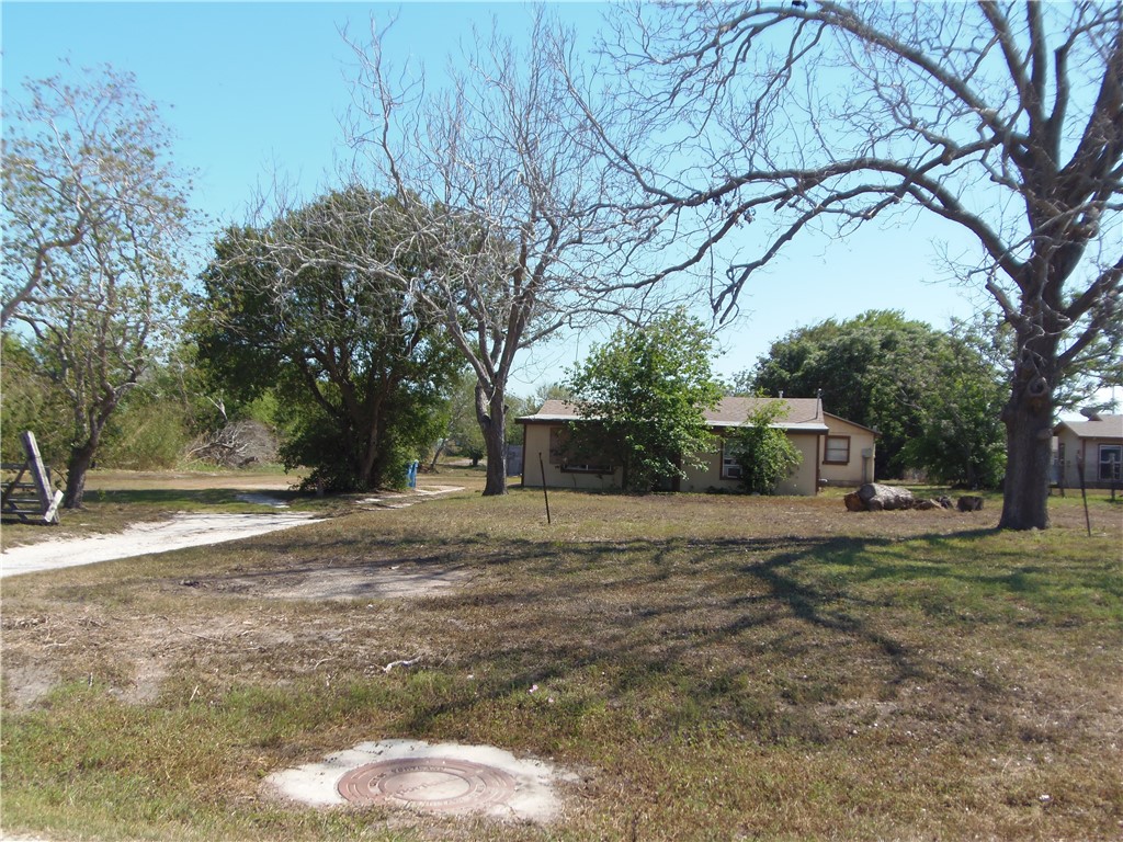 a house with yard in front of it