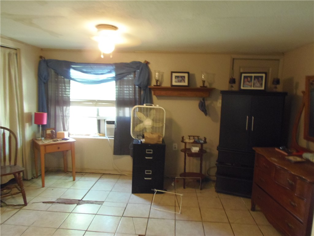 916 Marriott Drive Portland, TX 78374 - Photo 7 of 24 a room with furniture a flat screen computer and a window