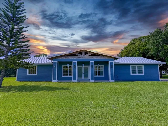 a view of a yard in front of a house