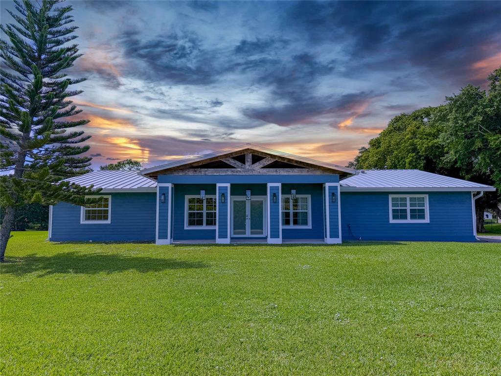 17420 Southwest 54th Street Southwest Ranches, FL 33331 - Photo 1 of 40 a view of a yard in front of a house