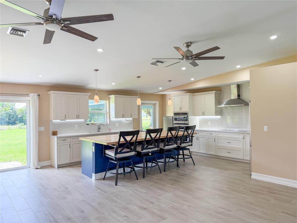17420 Southwest 54th Street Southwest Ranches, FL 33331 - Photo 11 of 40 a view of a dining room with furniture window and wooden floor