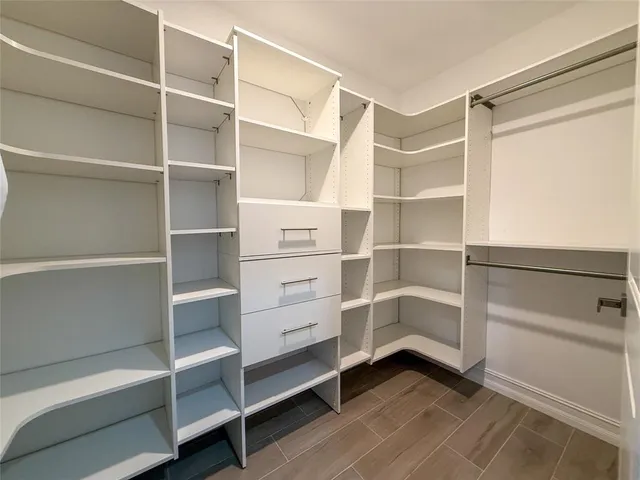 a view of an empty walk in closet
