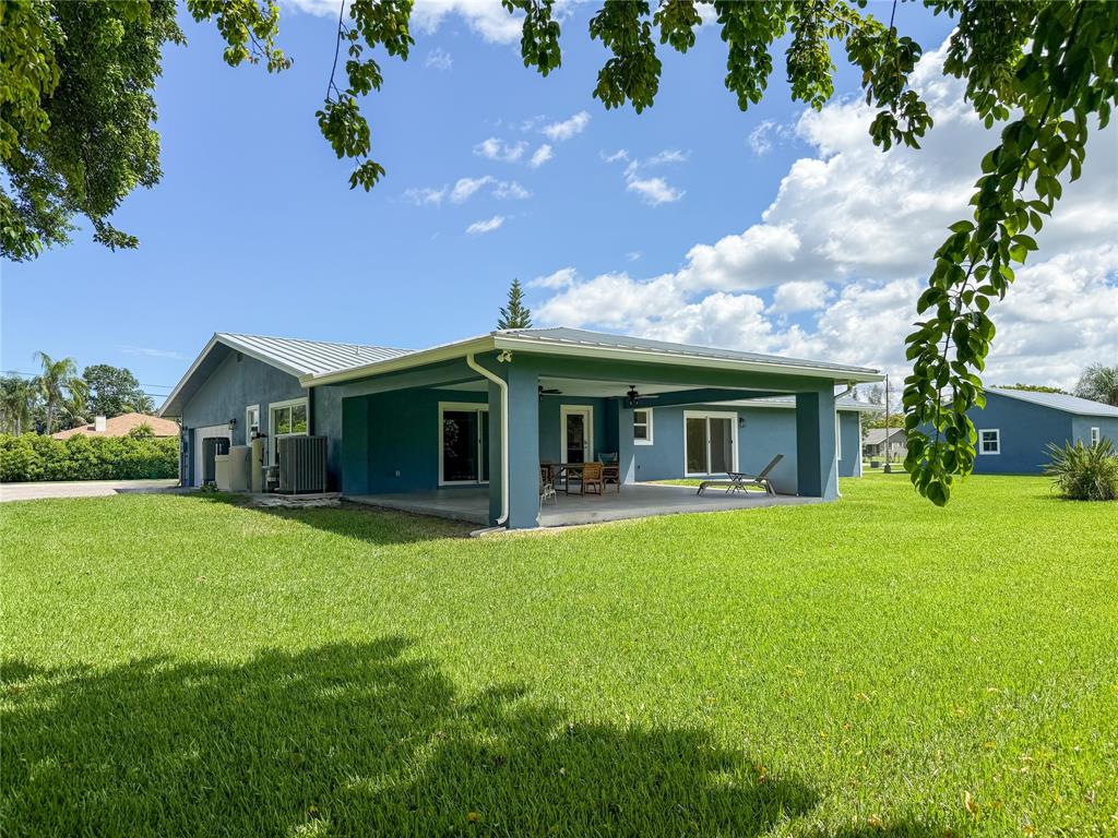 17420 Southwest 54th Street Southwest Ranches, FL 33331 - Photo 3 of 40 a front view of a house with a garden