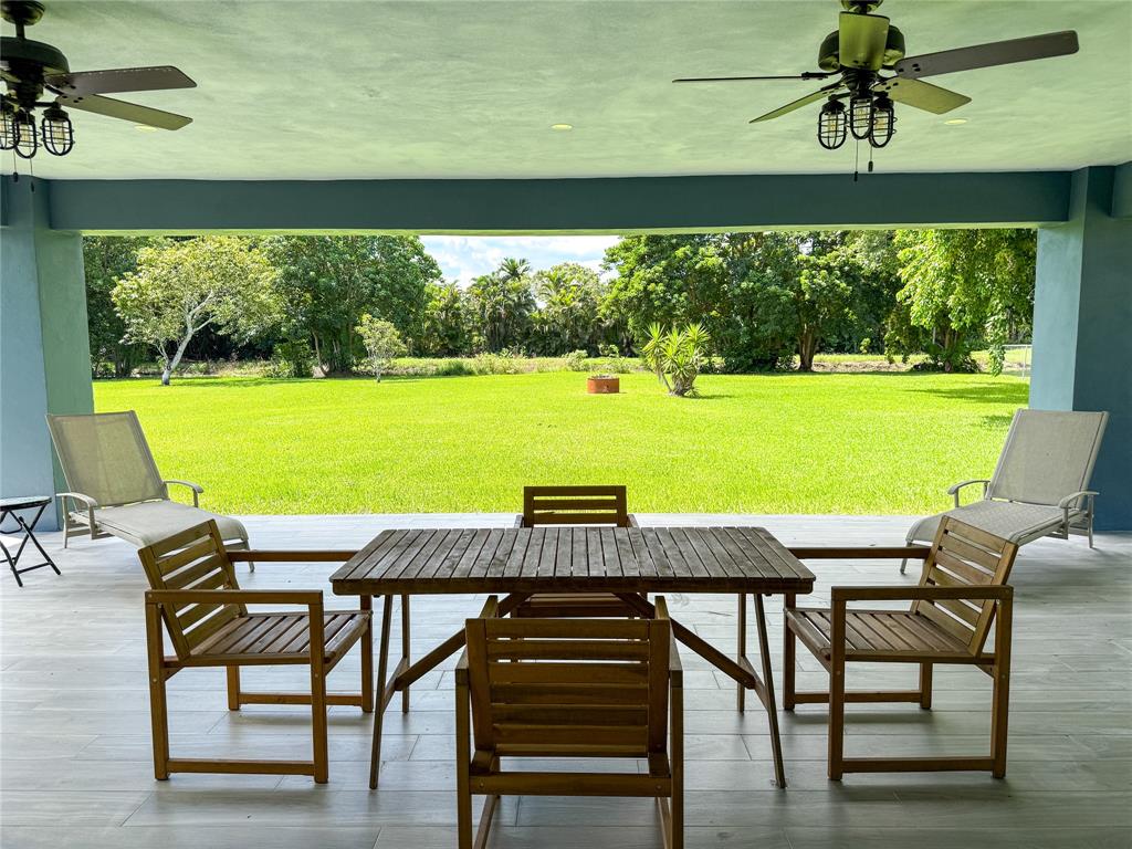 17420 Southwest 54th Street Southwest Ranches, FL 33331 - Photo 4 of 34 a view of a dining room with furniture window and outside view