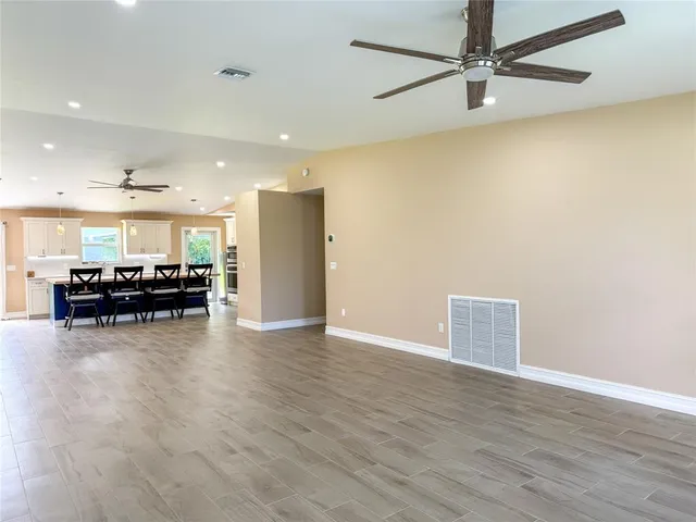 a view of kitchen with furniture and wooden floor