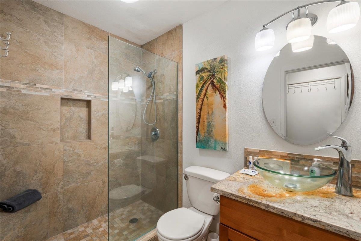 5271 Lower Honoapiilani Road, Unit B44 Lahaina, HI 96761 - Photo 13 of 25 a bathroom with a granite countertop sink toilet and shower