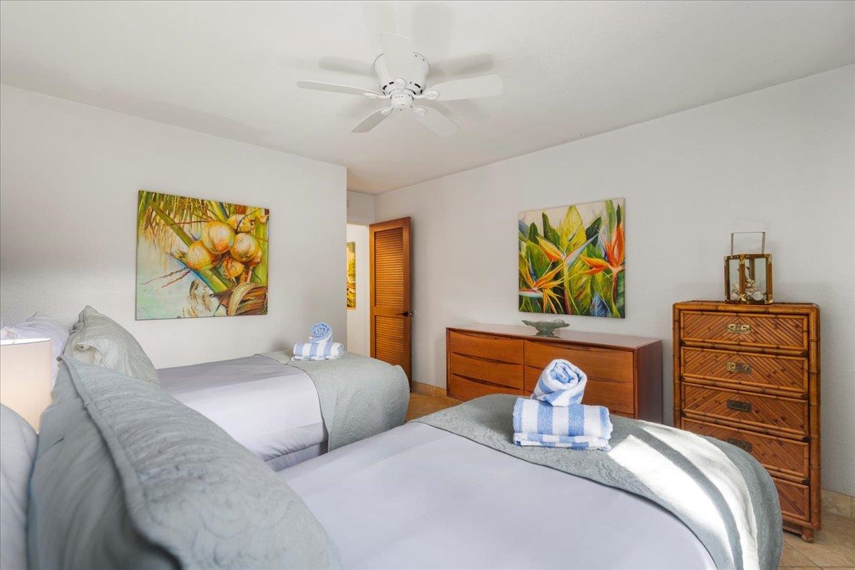 5271 Lower Honoapiilani Road, Unit B44 Lahaina, HI 96761 - Photo 15 of 25 a bedroom with a bed and ceiling fan