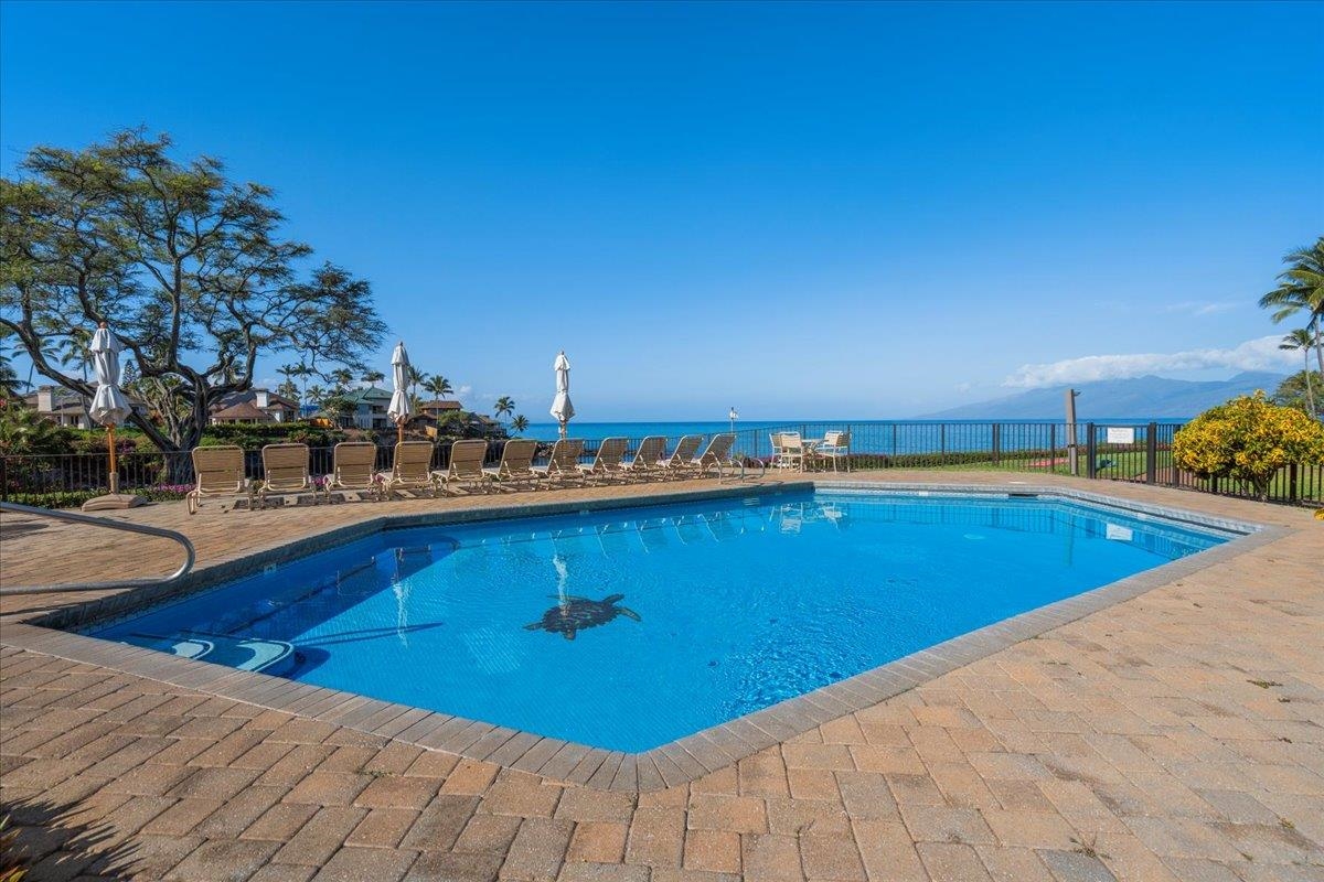 5271 Lower Honoapiilani Road, Unit B44 Lahaina, HI 96761 - Photo 18 of 25 a view of a swimming pool and an outdoor seating