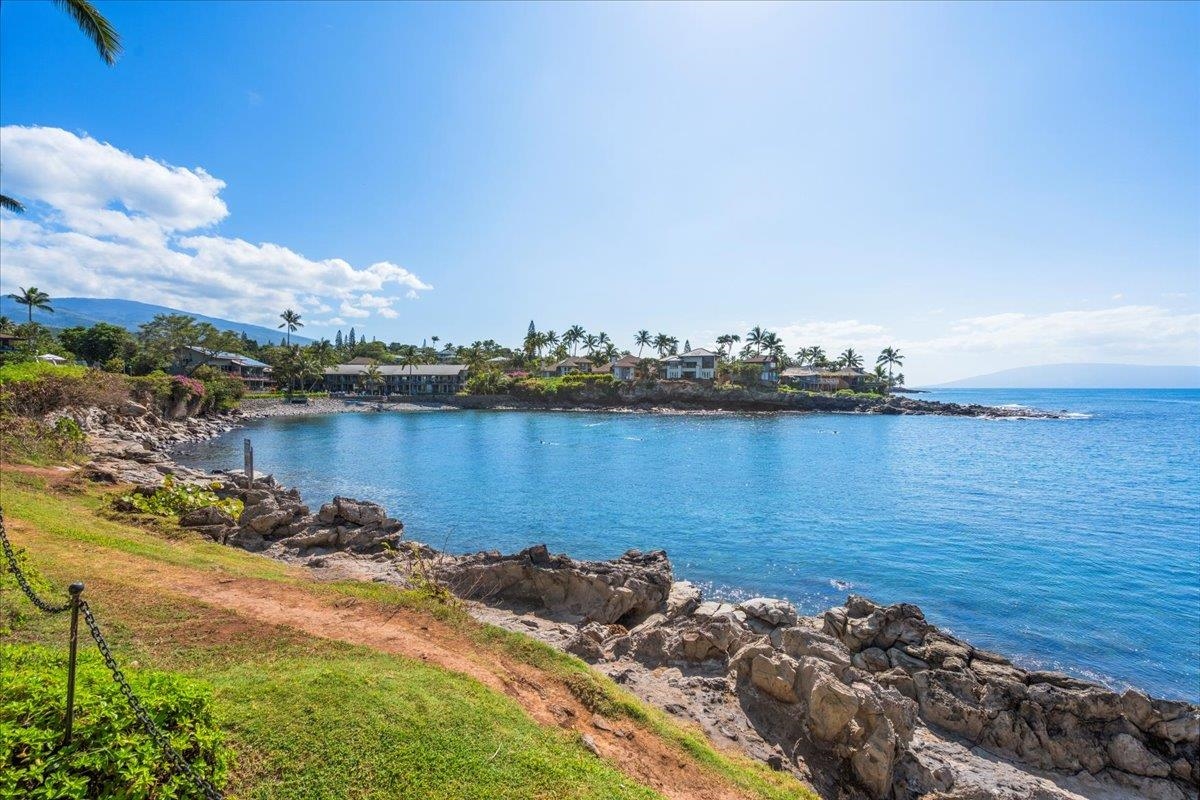 5271 Lower Honoapiilani Road, Unit B44 Lahaina, HI 96761 - Photo 22 of 25 a view of a ocean with boats and trees in the background