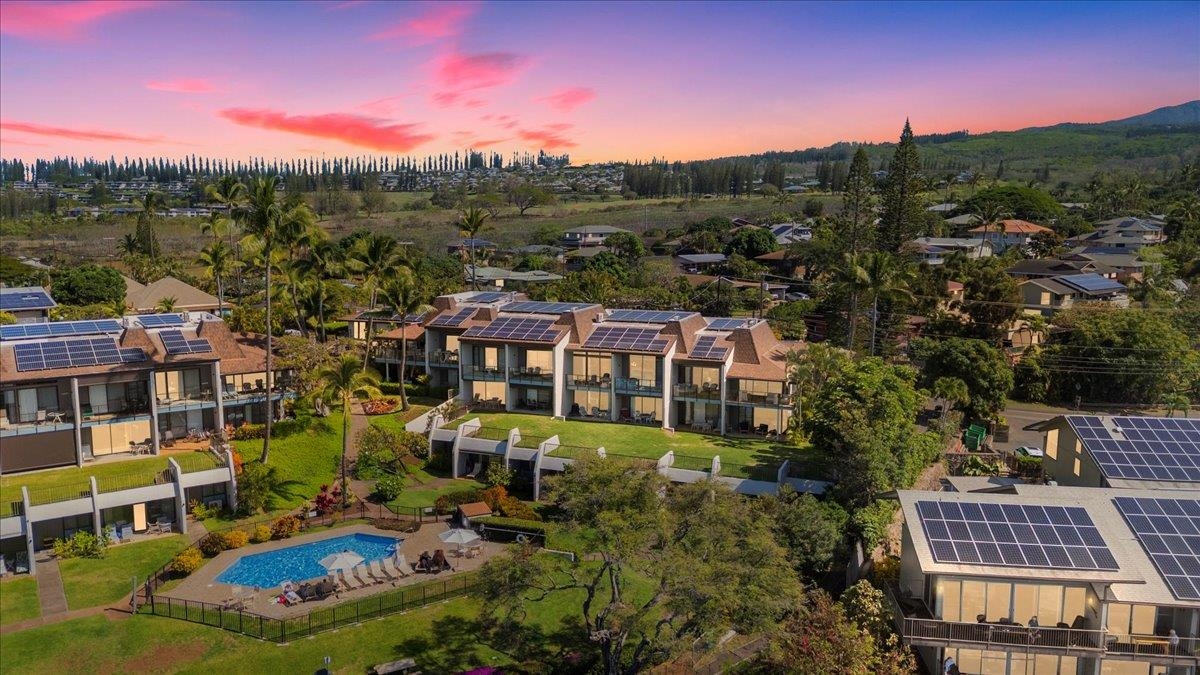 5271 Lower Honoapiilani Road, Unit B44 Lahaina, HI 96761 - Photo 24 of 25 a view of multiple houses with a yard
