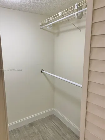 a view of a room with racks on the wall