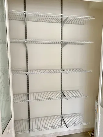a view of a room with racks on the wall