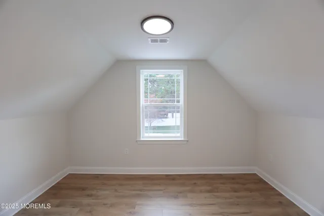 a white bath tub sitting next to a white sink