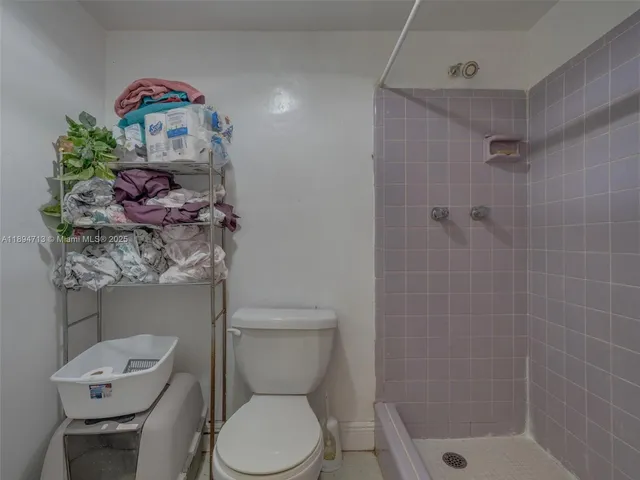 a bedroom with a bed and windows