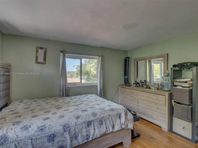 a bedroom with a bed and furniture