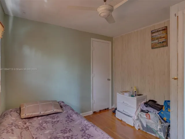 a living room with furniture a fireplace and a floor to ceiling window