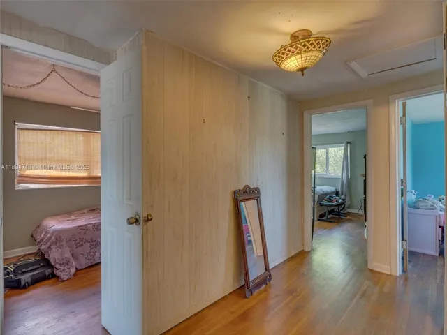 a living room with furniture a flat screen tv and a large window