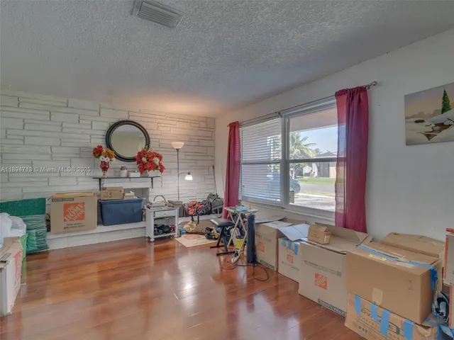 a view of kitchen with furniture and chandelier