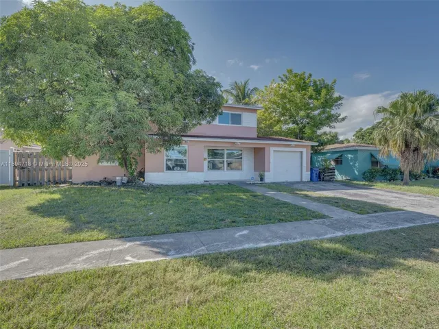 a front view of a house with a glass door