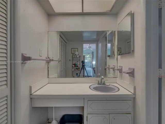 a bathroom with a toilet sink and shower