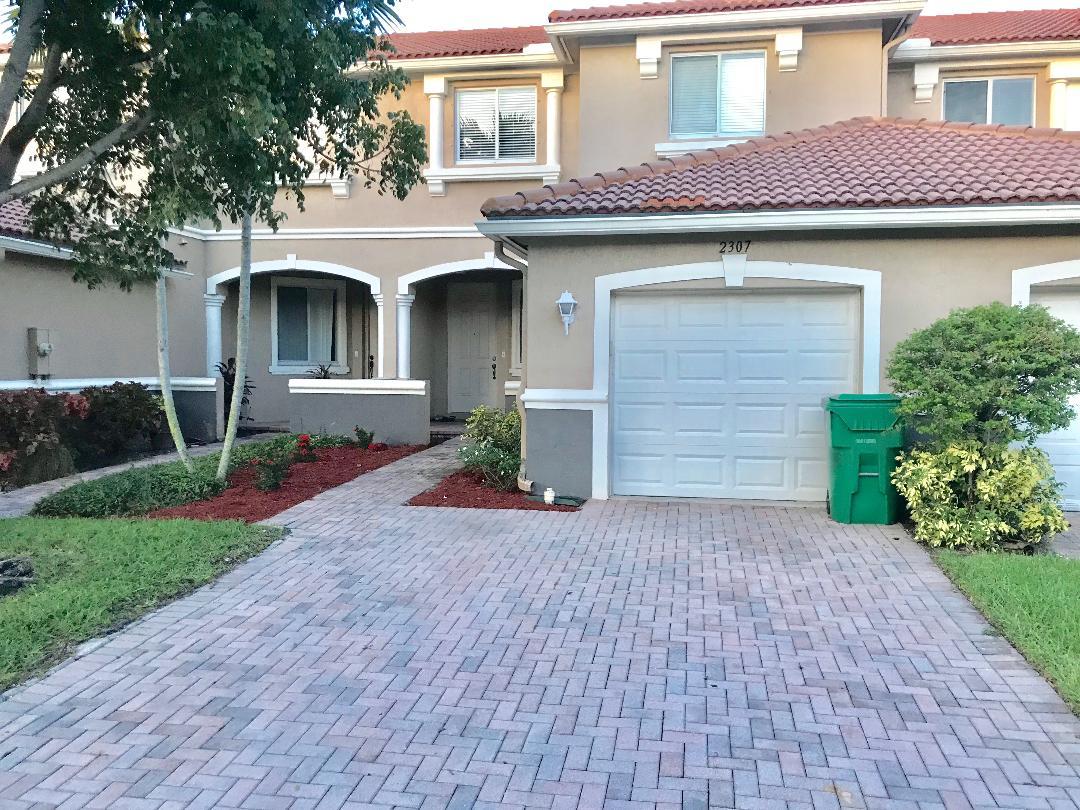2307 Center Stone Lane Riviera Beach, FL 33404 - Photo 1 of 42 FRONT