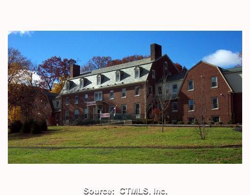 295 Ridge Road, Unit 11 Wethersfield, CT 06109 - Photo 1 of 1 a front view of a house with a yard