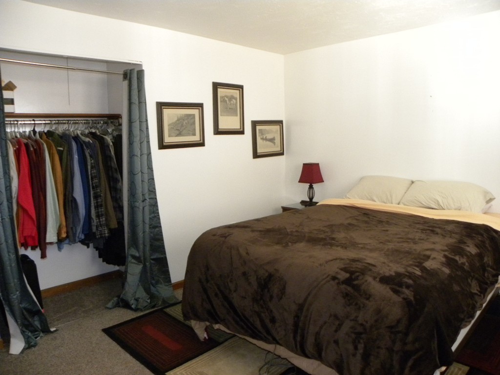 51 J Davis Road Charlton, MA 01507 - Photo 12 of 30 a bedroom with a bed and a mirror