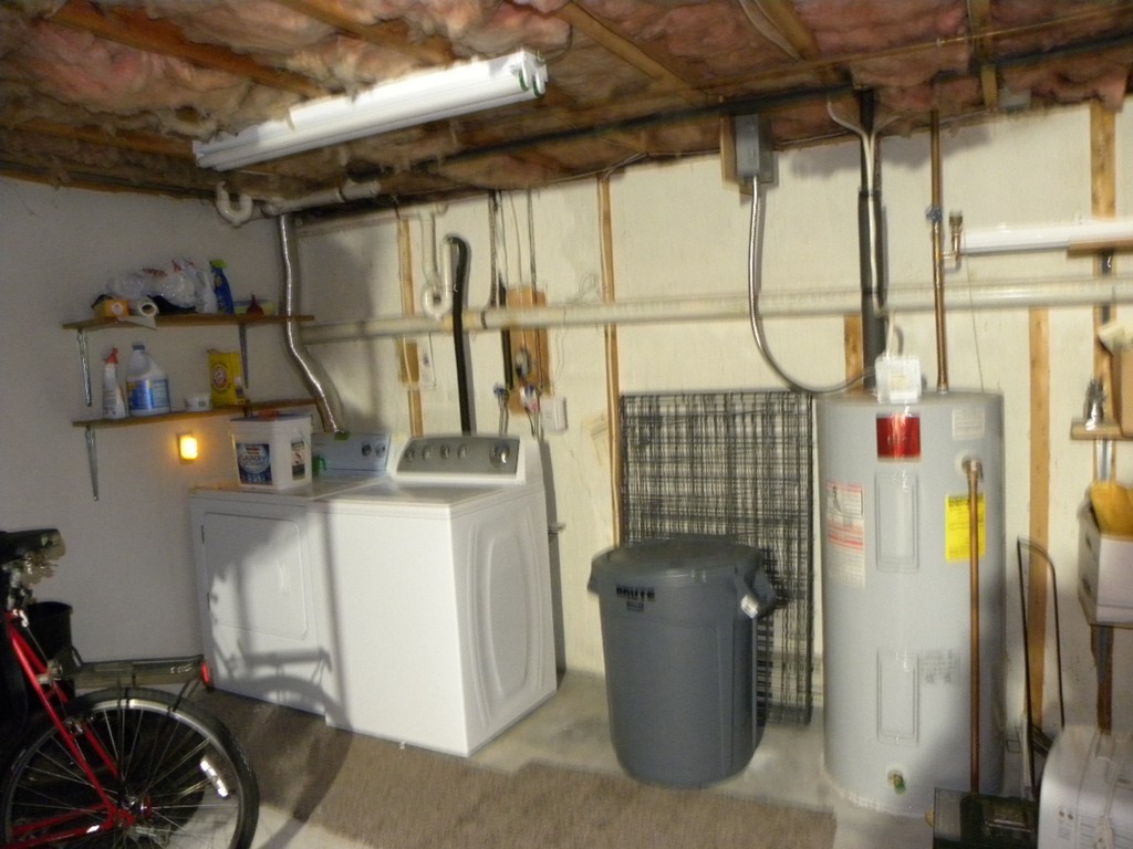51 J Davis Road Charlton, MA 01507 - Photo 20 of 30 a view of storage and utility room with refrigerator and washer