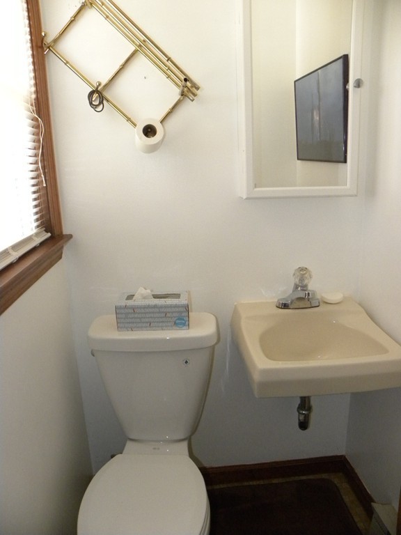 51 J Davis Road Charlton, MA 01507 - Photo 27 of 30 a bathroom with a toilet sink and mirror