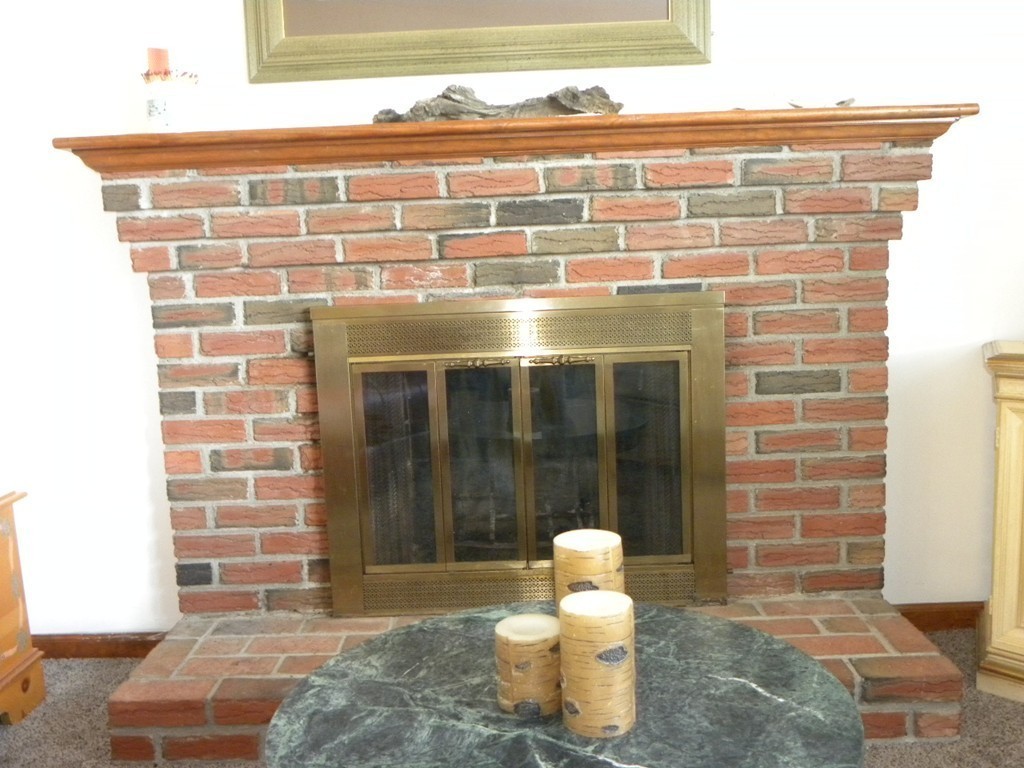 51 J Davis Road Charlton, MA 01507 - Photo 9 of 30 a view of a fireplace with wooden door