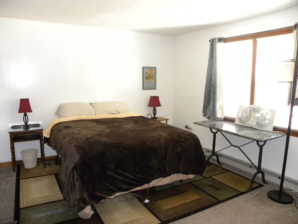 51 J Davis Road Charlton, MA 01507 - Photo 10 of 30 a bedroom with a bed and a window
