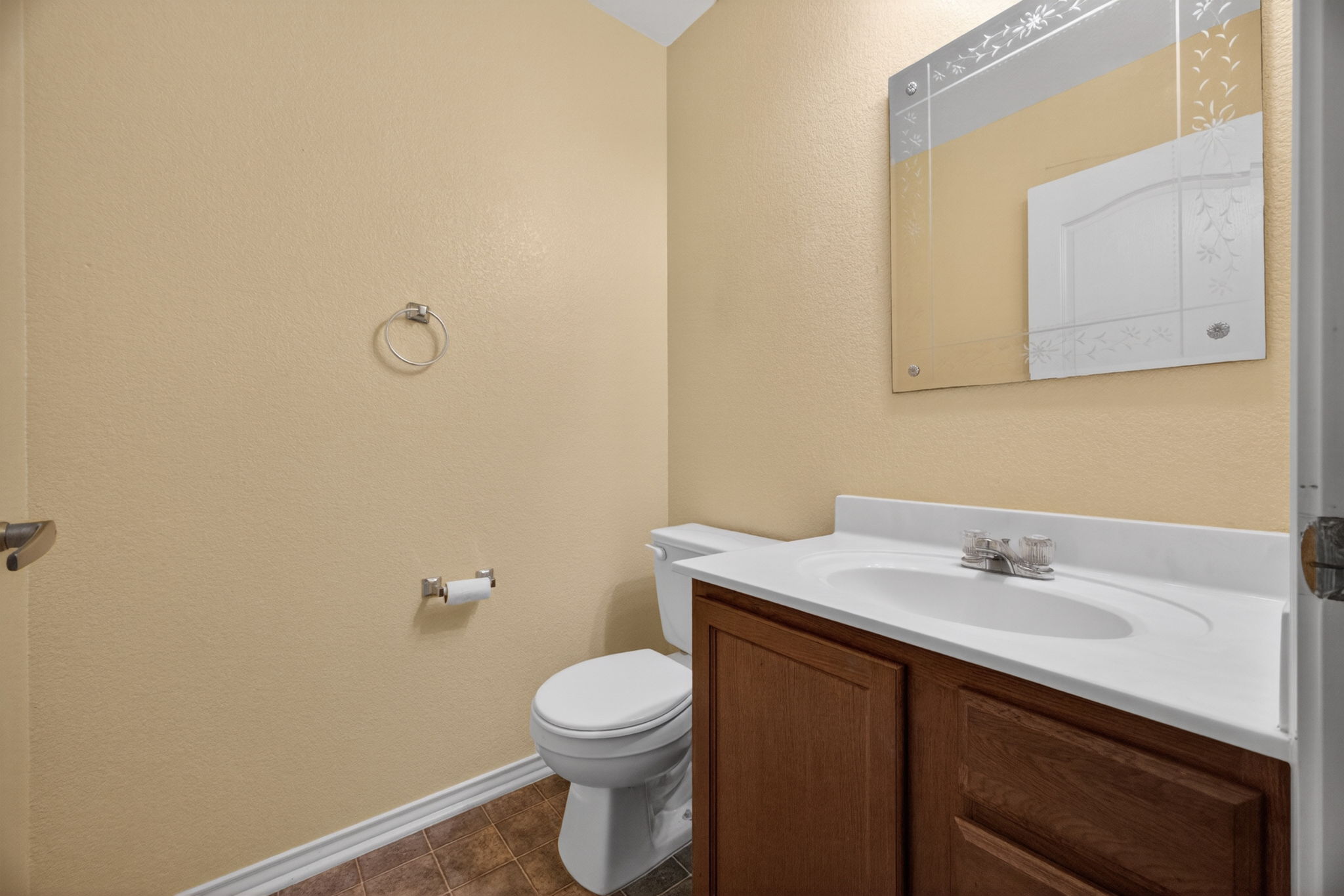 8813 Wiley Way Austin, TX 78747 - Photo 13 of 39 A well-appointed half bathroom located on the main level for guest