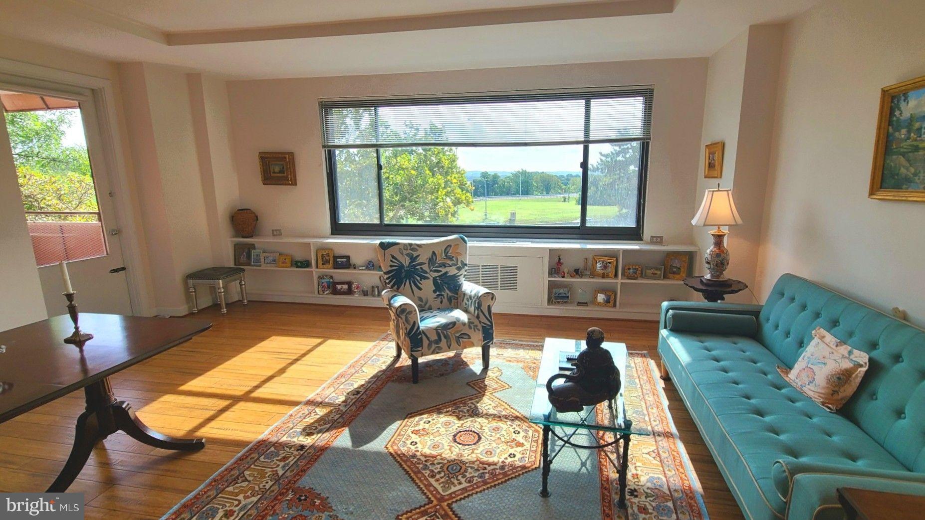 1021 Arlington Boulevard, Unit 330 Arlington, VA 22209 - Photo 11 of 48 a living room with furniture and a large window