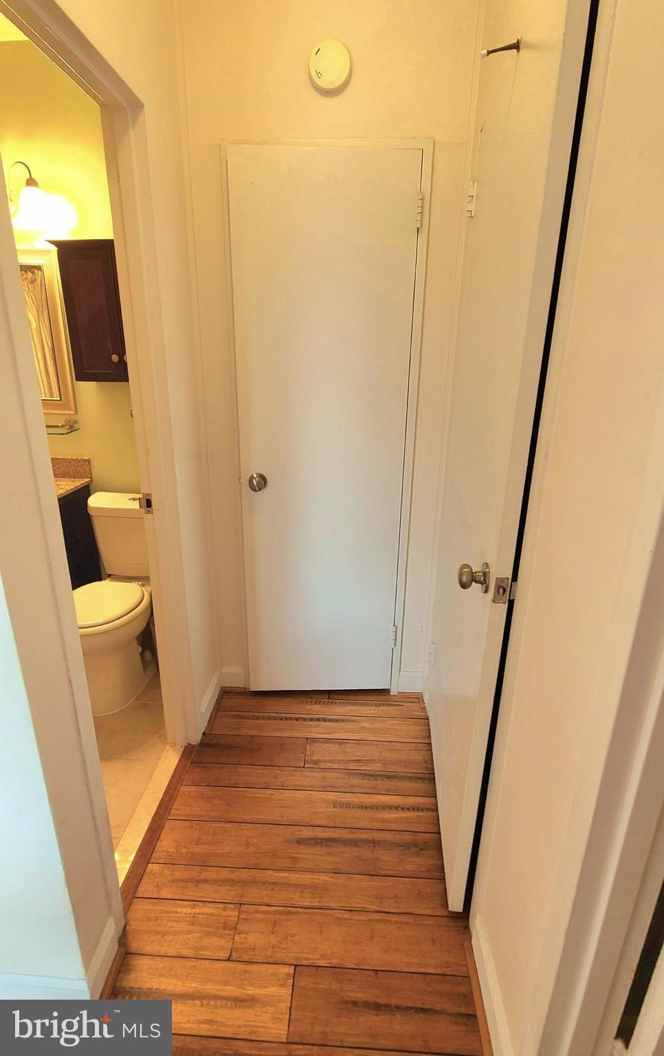 1021 Arlington Boulevard, Unit 330 Arlington, VA 22209 - Photo 19 of 48 a view of a bathroom with a sink and mirror in it