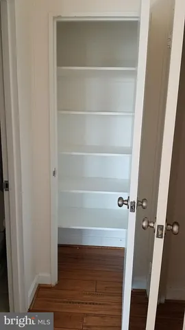 a bathroom with a double vanity sink toilet and shower