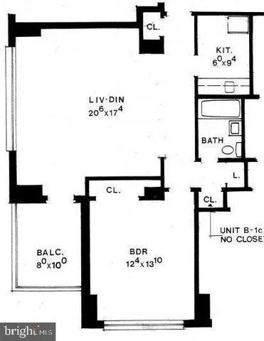 a large hall with stainless steel appliances kitchen island granite countertop a refrigerator and microwave