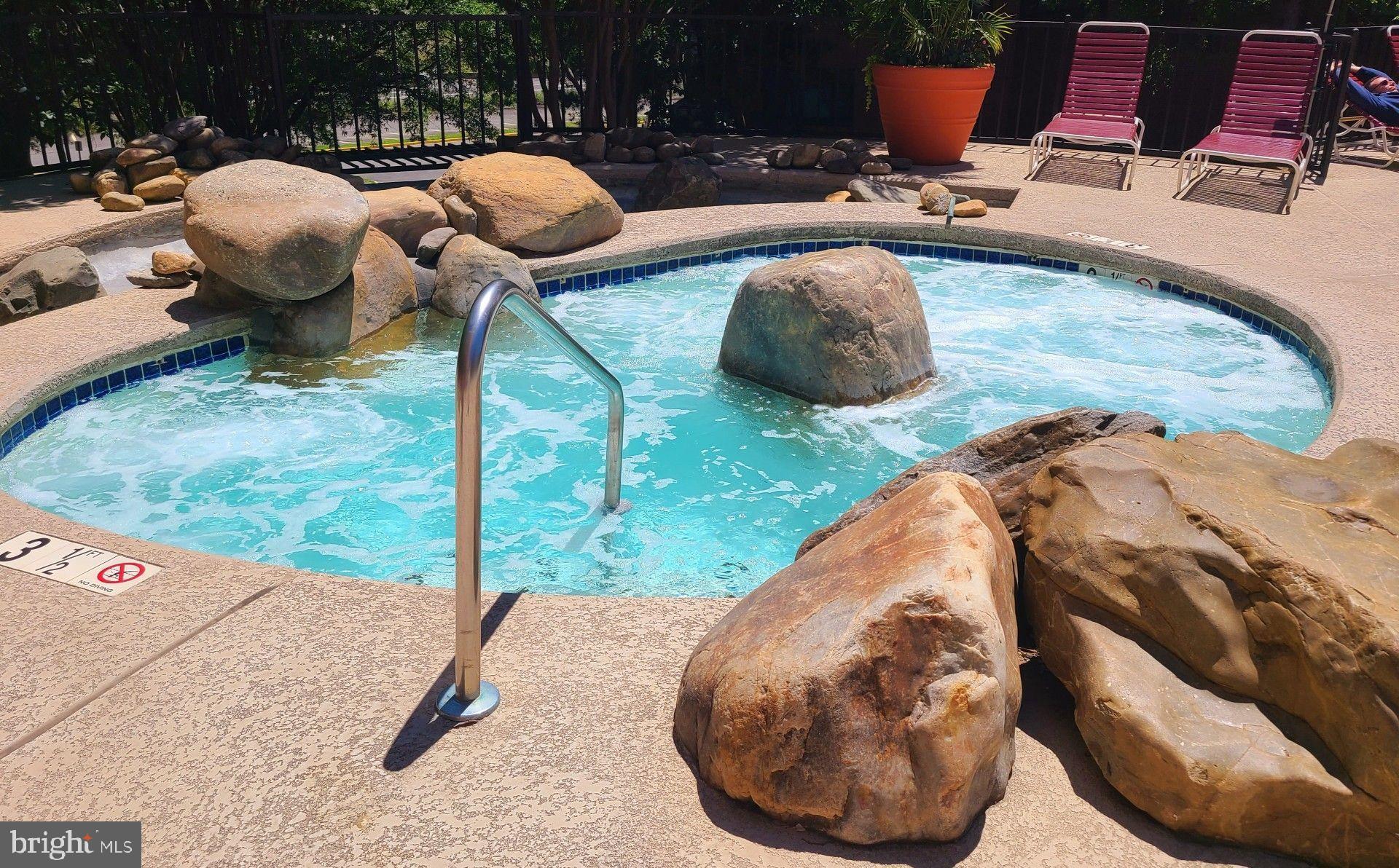 1021 Arlington Boulevard, Unit 330 Arlington, VA 22209 - Photo 36 of 48 a view of a swimming pool from a backyard