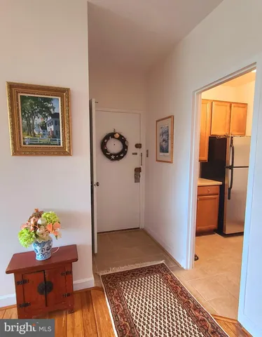 a view of an entryway with wooden floor
