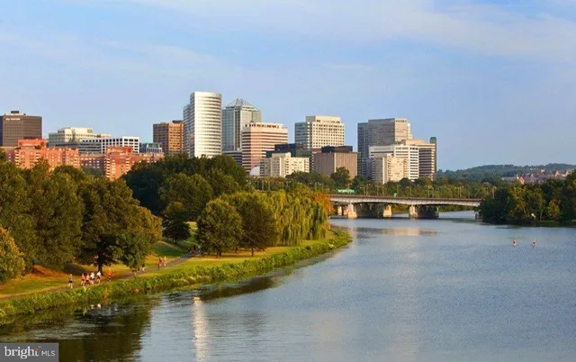 outdoor view of house with outdoor space and lake