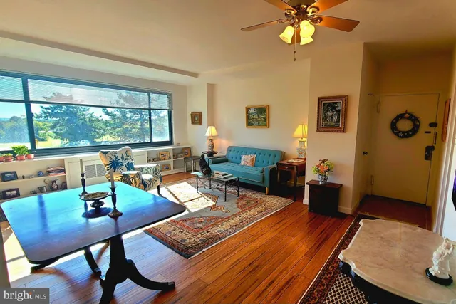 a living room with furniture and a large window