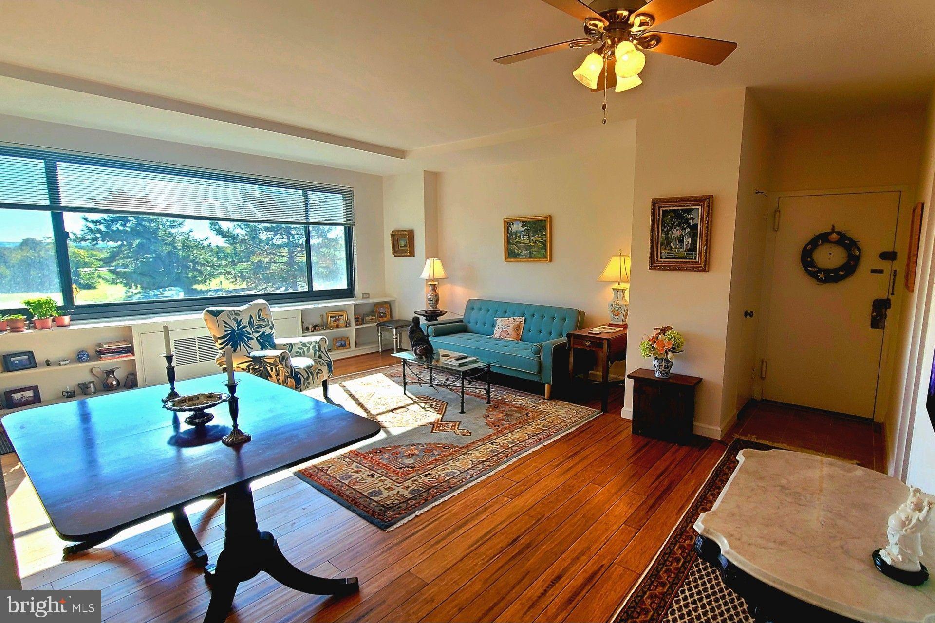 1021 Arlington Boulevard, Unit 330 Arlington, VA 22209 - Photo 9 of 48 a living room with furniture and a large window