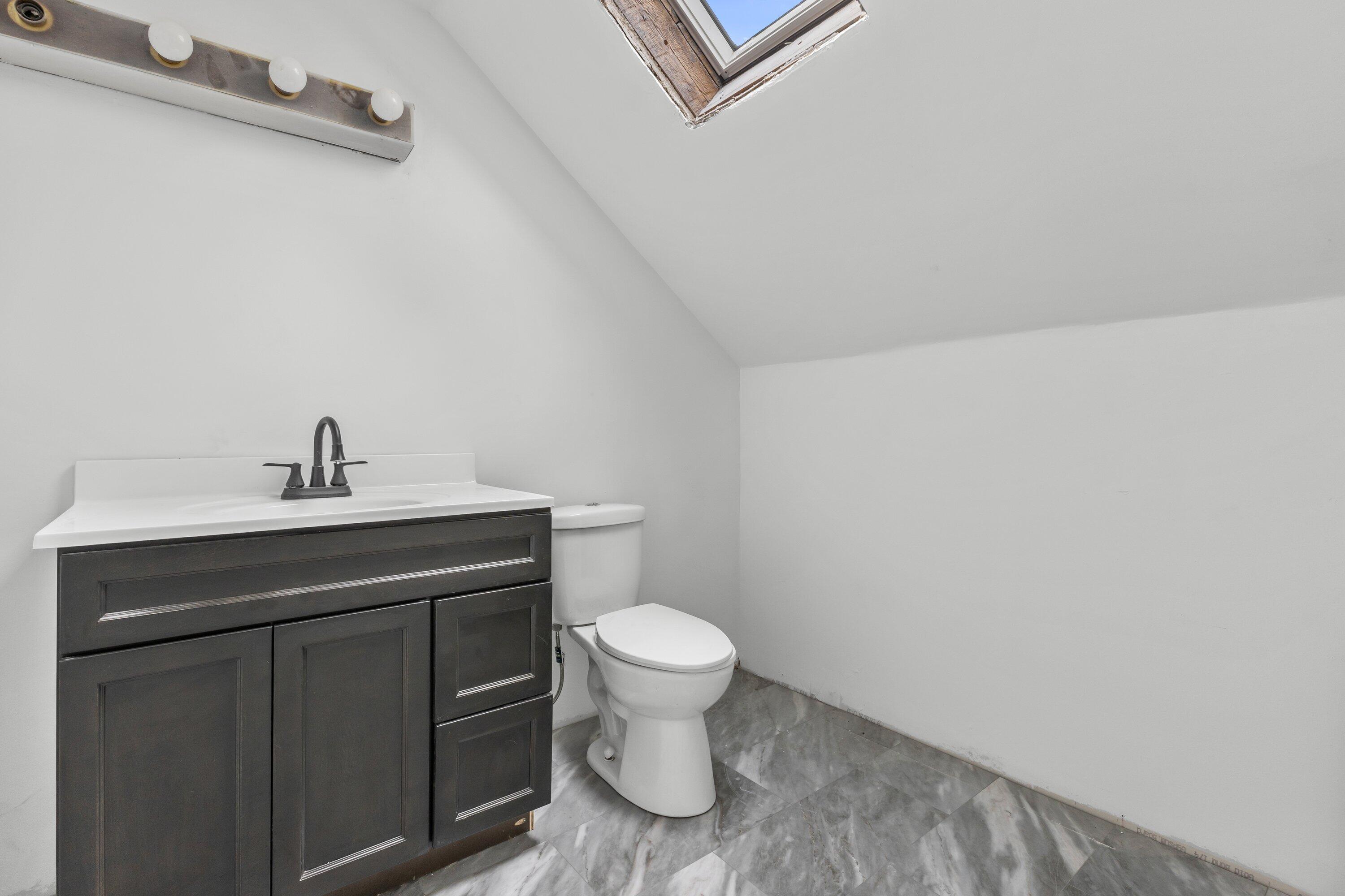 202 West Brown Deer Road Bayside, WI 53217 - Photo 21 of 32 New tile, vanity, skylight