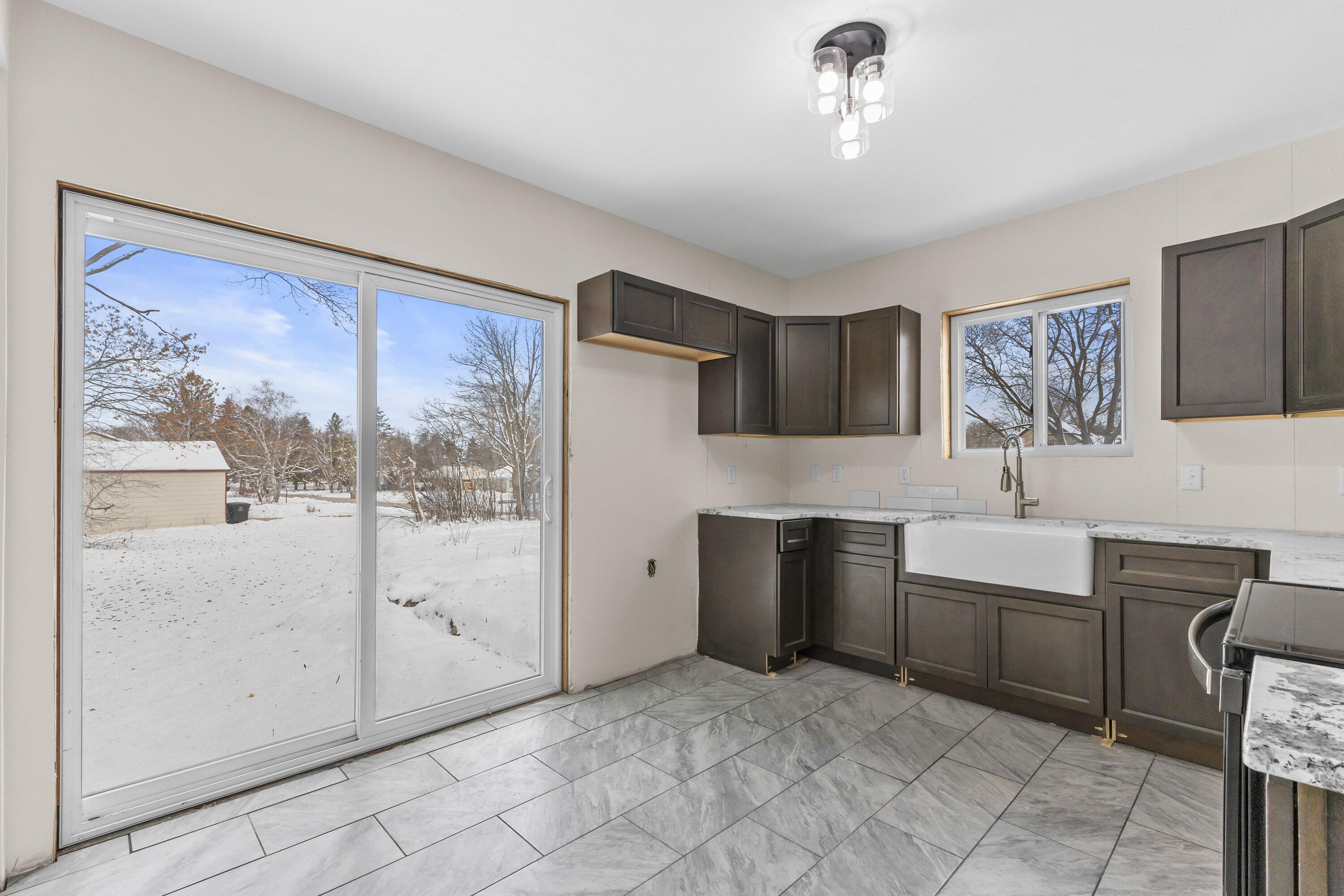 202 West Brown Deer Road Bayside, WI 53217 - Photo 10 of 32 New patio doors open to yard
