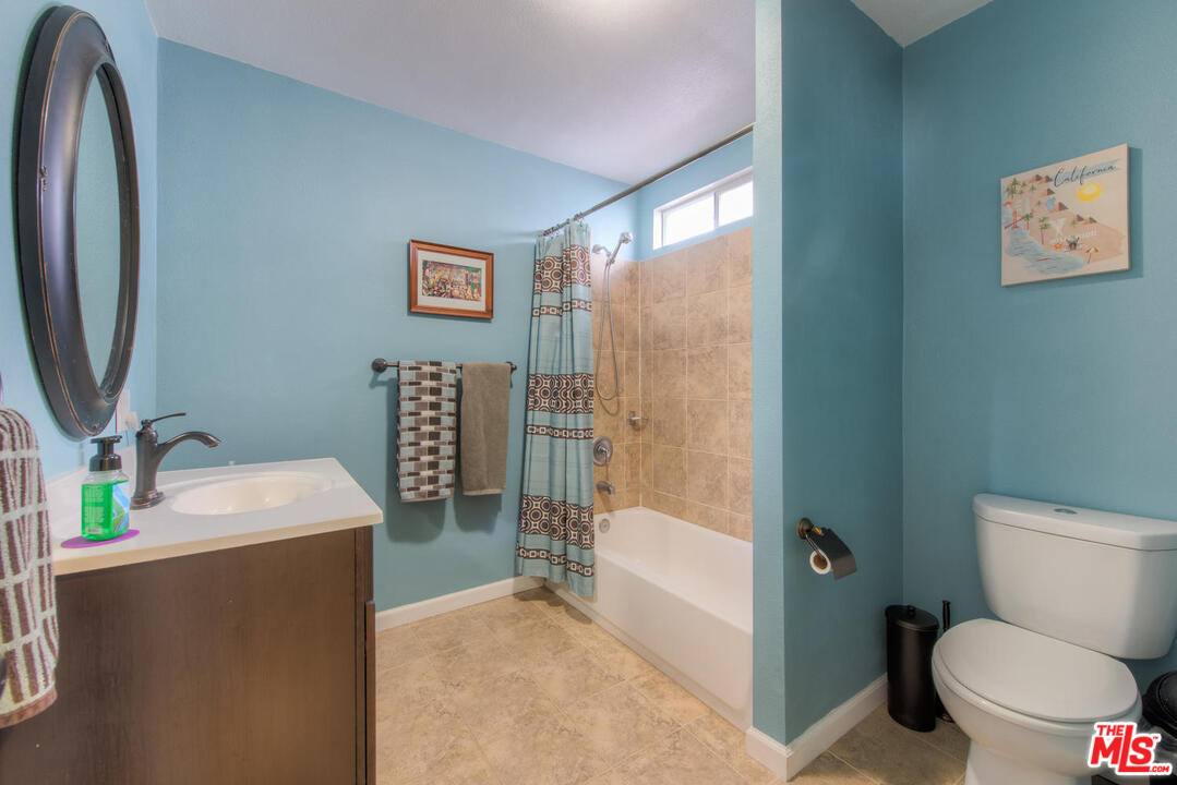 10541 Chandler Boulevard North Hollywood, CA 91601 - Photo 13 of 17 a bathroom with a sink toilet and shower