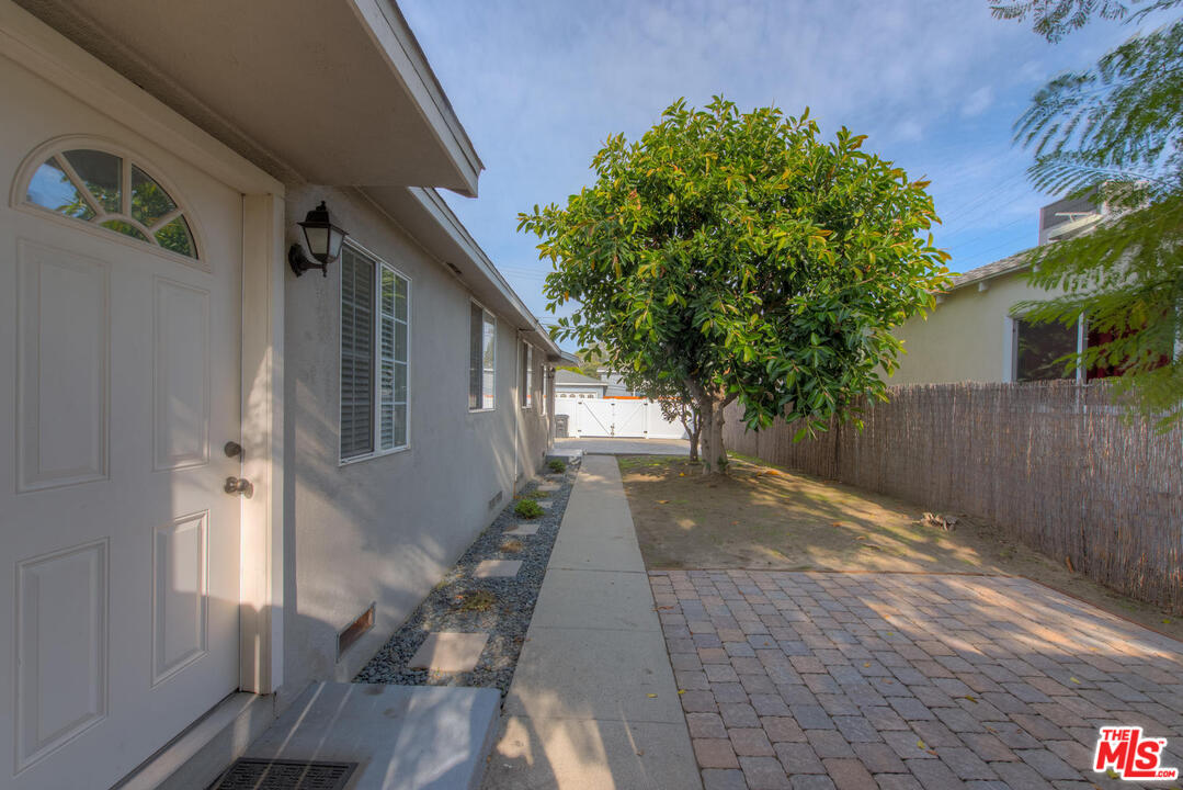 10541 Chandler Boulevard North Hollywood, CA 91601 - Photo 15 of 17 a view of a house with a backyard