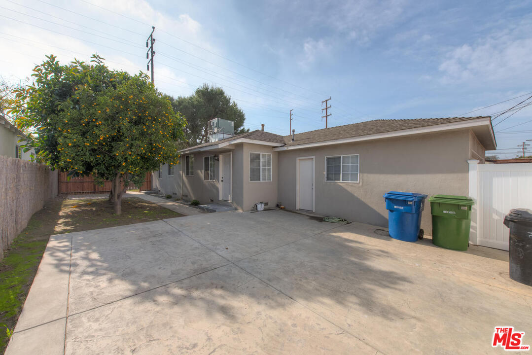 10541 Chandler Boulevard North Hollywood, CA 91601 - Photo 16 of 17 a view of a house with a backyard and garage