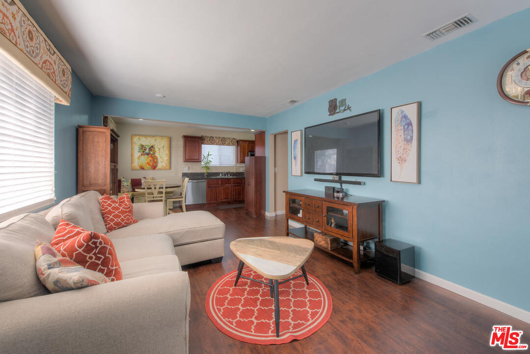 10541 Chandler Boulevard North Hollywood, CA 91601 - Photo 3 of 17 a living room with furniture and a flat screen tv